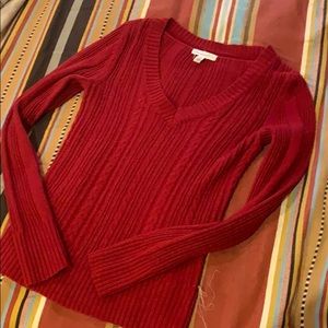 Red cable knit sweater.